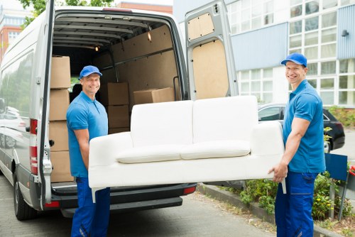 Furniture removal team handling a move in a Stockwell street with typical South London access challenges