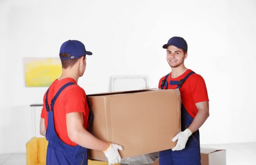 Office moving team preparing business equipment in Stockwell