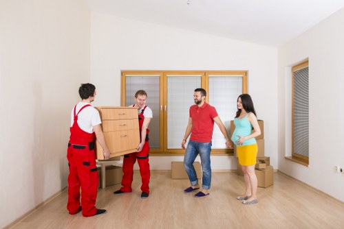 Careful loading of sofas and tables for a local Stockwell furniture removal job