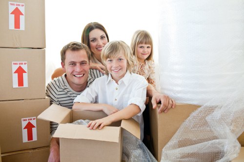 Local movers preparing items in a Stockwell flat with tight access